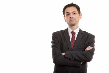 Studio shot of young businessman with arms crossed