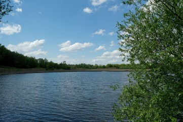 Obraz premium Landscape with lake and blue sky