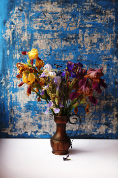 bouquet of irises in the antique vase