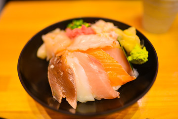 Japanese rice bowl with sashimi seafood on top