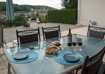  Dinner on the terrace with Carlux in the background. Dordogne valley, Aquitaine,  France