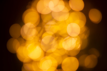 Yellow bokeh lights from the lamp convey warmth, lights on bokeh as background, bokeh light abstract background, Blurred blur, darkness concept