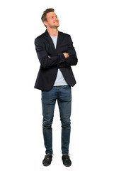 Blonde handsome man looking up while smiling