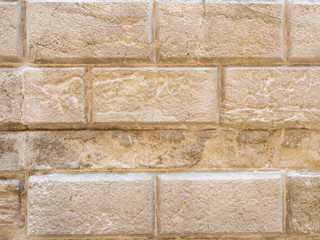 Old Stucco Wall in Venice. Venetian Stucco. Vintage Old Wall Background in warm peach colors. Stone Masonry Texture. 