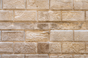 Old Stucco Wall in Venice. Venetian Stucco. Vintage Old Wall Background in warm peach colors. Stone Masonry Texture. 