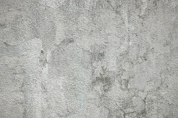 ムラのあるグレーの石壁の背景素材