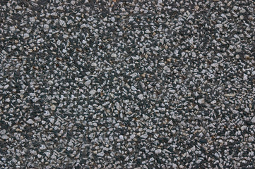 Asphalt road is dark grey with a rough surface.Texture or background.