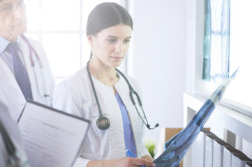 Group of doctors checking x-rays in a hospital