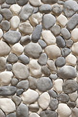 A fake stone in the form of gray and black cobblestones