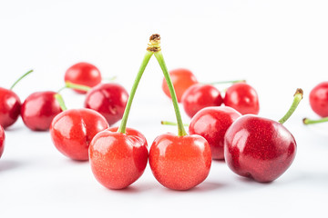 Fresh red cherries on white background