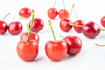 Obraz na płótnie Canvas Fresh red cherries on white background