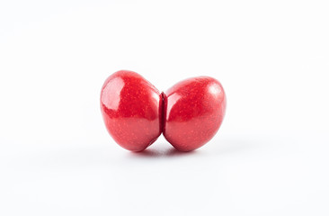 Fresh red heart shaped cherry closeup on white background