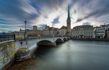 Kirche Fraumünster in Zürich, Switzerland. Panoramic Long exposure view of the historic city center of Zurich with famous Fraumunster Church from the river Limmat , Zurich, Switzerland.