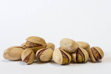 Pistachios in shell isolated in white. Close up macro shot. 