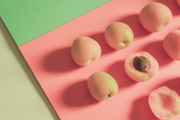 Seamless pattern with apricot. Tropical abstract background. Apricot on the pink background. - Image 