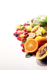 Fresh summer fruits with apple, peach, papaya, berries, pear and apricot.