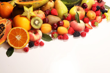 Fresh summer fruits with apple, peach, papaya, berries, pear and apricot.