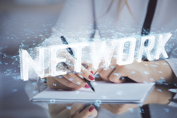 Multi exposure of woman's writing hand on background with data technology hud. Big data concept.