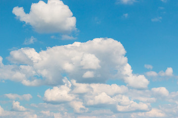 white clouds on blue background
