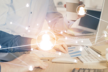 Social network theme hologram with businessman working on computer on background. Multi exposure.