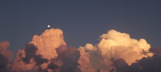 Rising Sunset Clouds with Moon