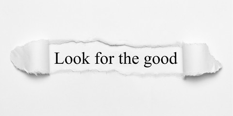 Look for the good on white torn paper