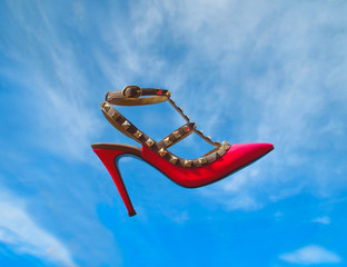 Pink shoes floating in the sky