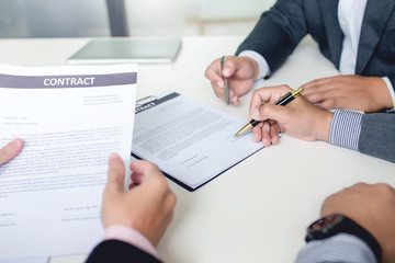 Businessman signed a contract agreement to invest together.