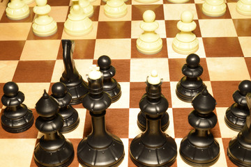 Chessboard under black pawns like a skill background