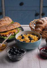 Delicious croissant. Breakfast. Cornflakes. Cereal baguette. Food. Sweet lunch. Bowl corn flakes. Fresh healthy meal