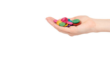 Hand with colorful sewing buttons, decoration accessory.