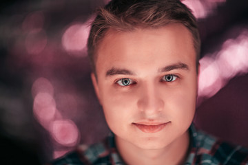 portrait of a young man on a blurred background