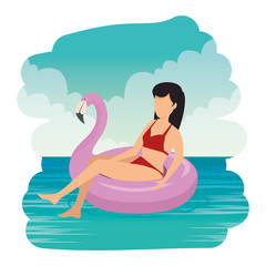 young man with swimsuit and float donut in the sea