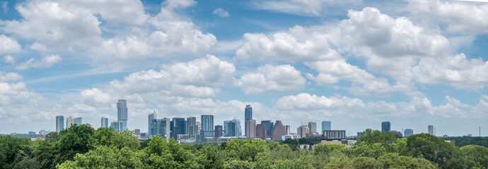 Panoramic View of Austin Texas Downtown Skyline With Bright Sun and Cloudy Skies