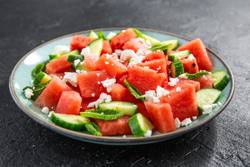 Fototapeta na wymiar Summer salad with watermelon and cucumbers