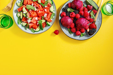 Summer salads with watermelon and cucumbers, berries and ice cream