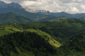 Fototapeta premium A Strip of Sun Light Falling on the Mountain Landscape on a Cloudy Day