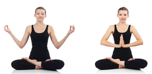 Obraz na płótnie Canvas Young woman sitting cross-legged and doing yoga 