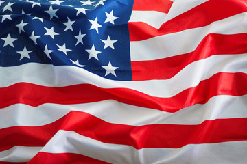 Bright voluminous flag of the United States of America on Independence Day close up