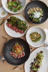 Fish and meat meals variety flat lay. salads. Top view on buffet with assortment of healthy hearty food. Buffet, banquet,restaurant menu concept