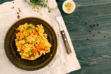 Vegetarian paella, salt, thyme herb, champignons, oil, spice on wooden table. Top view.