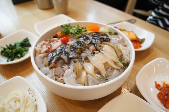 Korean Traditional Sasimi served with cold spicy sauce, called 'mul-hoi'