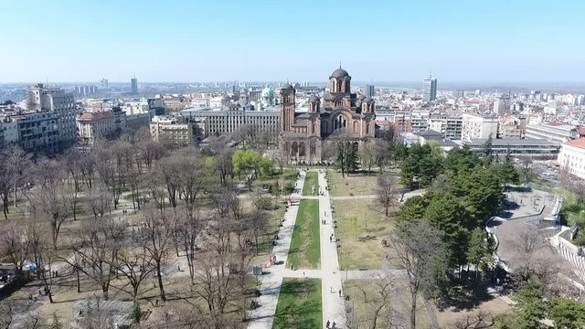 Aerial view of Tasmajdan park in the Belgrade city the capital of Serbia with Serbian Orthodox Church of Saint Marko  building and people walking view from above