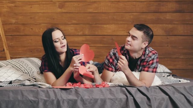 Young couple having fun in studio. Attractive man and woman being playful at studio
