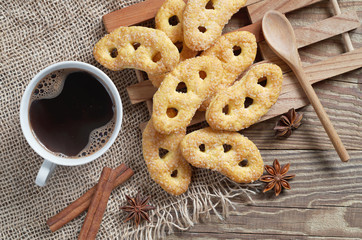 Heap of pretzels with sugar and coffee