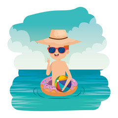 cute little boy with donut float and beach balloon on the sea