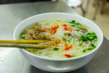 A bowl of chicken noodle soup for breakfast  in a restaurant in Hanoi, Vietnam