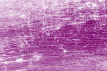 Grunge, dirty, scratched, unevenly colored purple background.
