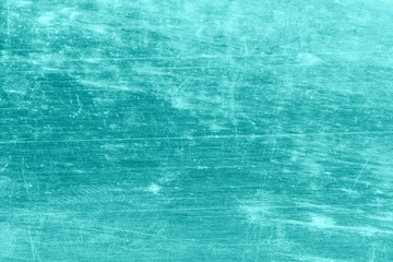 Grunge, dirty, scratched, unevenly colored blue background.