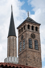 Fototapeta na wymiar Sarajevo, Bosnia: Sarajevska Sahat Kula, the Clock Tower built by Gazi Husrev-beg, governor in the Ottoman period, and the minaret of Gazi Husrev-beg Mosque (1532) in the Bascarsija neighborhood